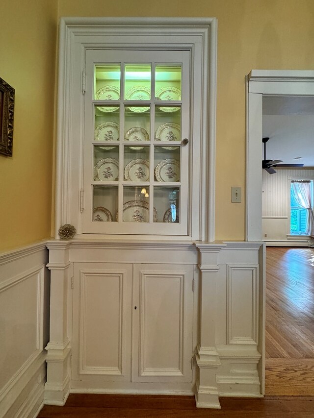 details with ceiling fan and hardwood / wood-style flooring