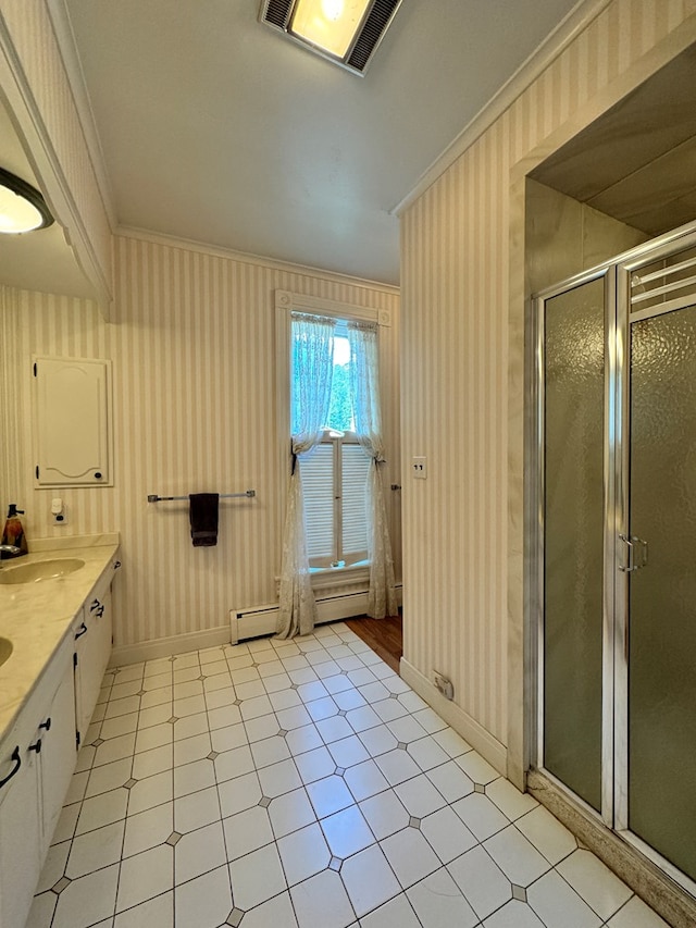 bathroom featuring crown molding, vanity, and a shower with shower door