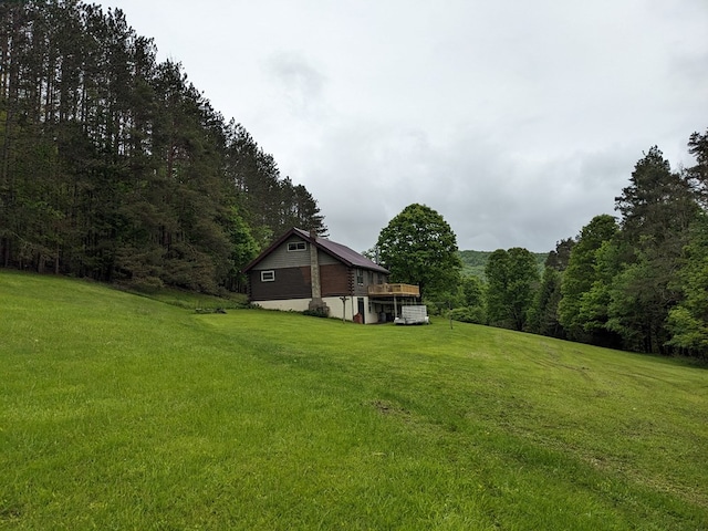 153 Pinneo Hill Rd, Oswayo, PA 16915 - view of grassy yard with a forest view and a wooden deck