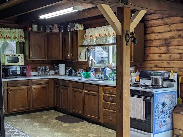 153 Pinneo Hill Rd, Oswayo, PA 16915 - kitchen featuring gas range, light countertops, black microwave, and stainless steel microwave