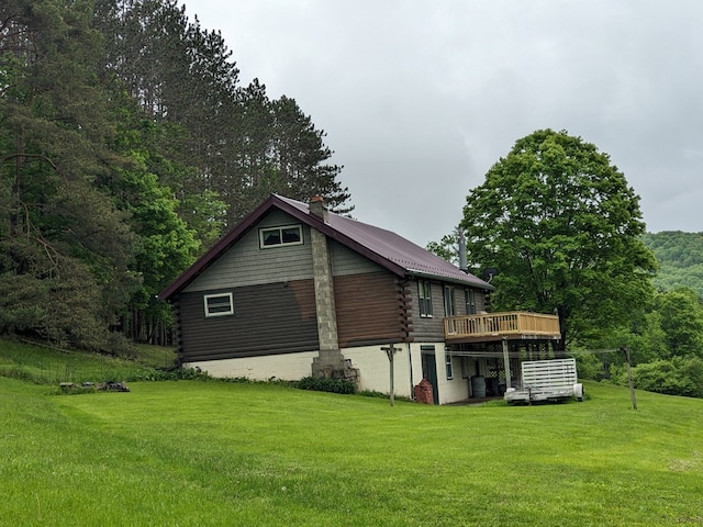 153 Pinneo Hill Rd, Oswayo, PA 16915 - view of home's exterior featuring log siding, a deck, and a lawn