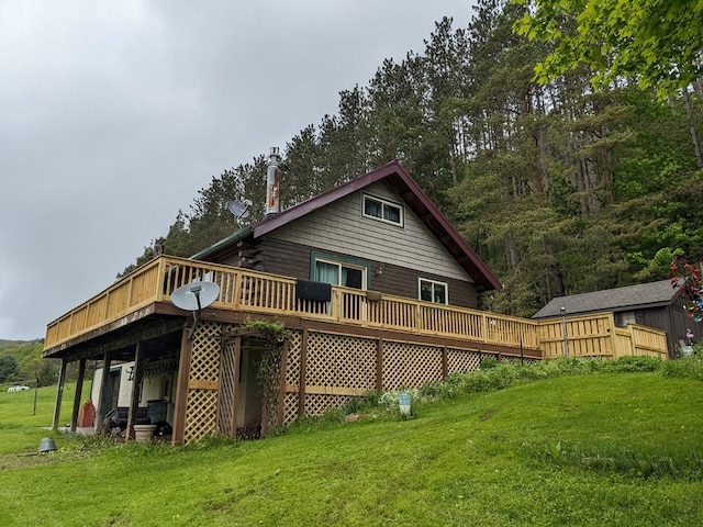153 Pinneo Hill Rd, Oswayo, PA 16915 - back of property featuring a deck, a yard, and a chimney