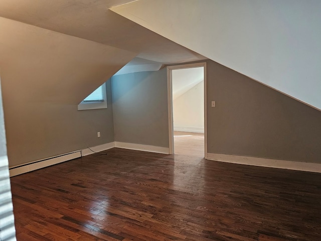 202 Cliff St, Montrose, PA 18810 - bonus room featuring baseboard heating, wood finished floors, vaulted ceiling, and baseboards
