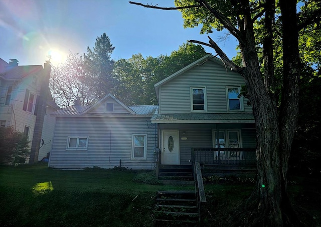 202 Cliff St, Montrose, PA 18810 - traditional-style house with covered porch, a front yard, and metal roof