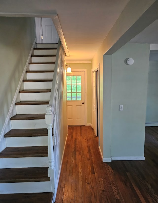 202 Cliff St, Montrose, PA 18810 - stairs with wood finished floors, a baseboard heating unit, and baseboards