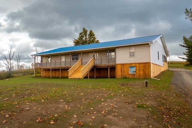 2760 Mercur Hill Rd, Wysox, PA 18854 - back of house with driveway, a wooden deck, stairway, and a yard