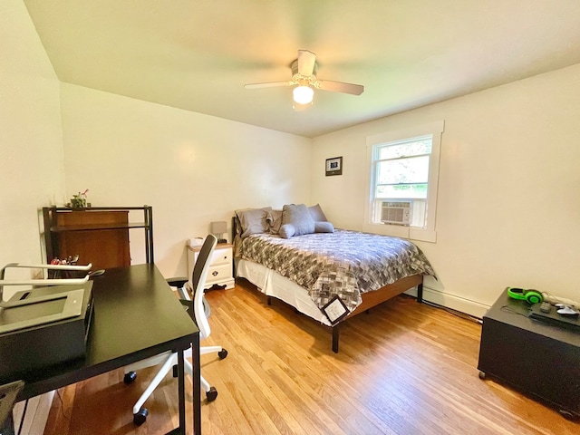 403 Horse Thief Run Rd, Wellsboro, PA 16901 - bedroom featuring light wood-type flooring, baseboard heating, an office area, a ceiling fan, and baseboards