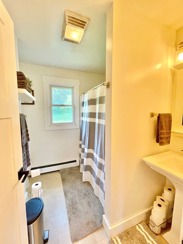 403 Horse Thief Run Rd, Wellsboro, PA 16901 - full bath with a baseboard heating unit and curtained shower
