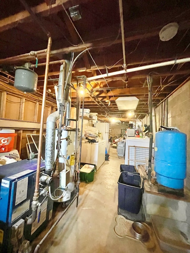 403 Horse Thief Run Rd, Wellsboro, PA 16901 - unfinished below grade area featuring a water pressure tank and independent washer and dryer