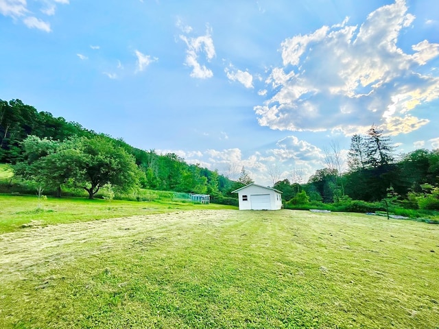 403 Horse Thief Run Rd, Wellsboro, PA 16901 - view of grassy yard featuring a view of countryside, an outbuilding, and a garage