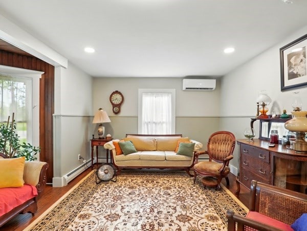 175 Rte 467, Wysox, PA 18854 - living room featuring a wall unit AC, wood finished floors, recessed lighting, and baseboards