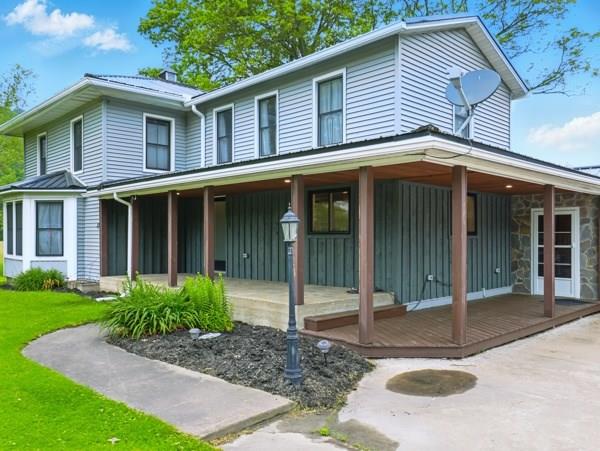 175 Rte 467, Wysox, PA 18854 - farmhouse inspired home with a porch, board and batten siding, and a front lawn
