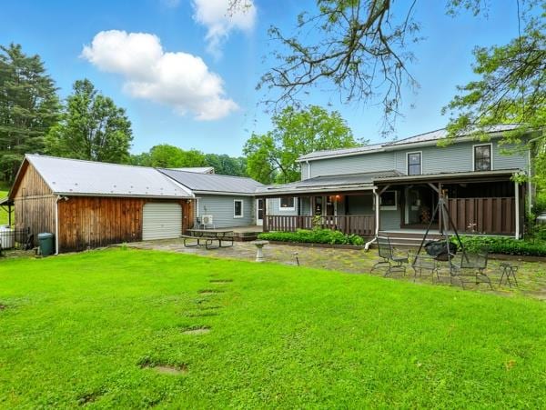 175 Rte 467, Wysox, PA 18854 - rear view of property with a lawn, an outbuilding, and a garage