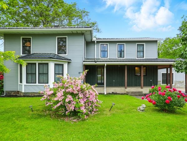 175 Rte 467, Wysox, PA 18854 - rear view of property featuring a yard, board and batten siding, and covered porch
