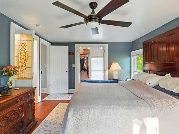 175 Rte 467, Wysox, PA 18854 - bedroom with dark wood-style floors, a ceiling fan, a walk in closet, and baseboards