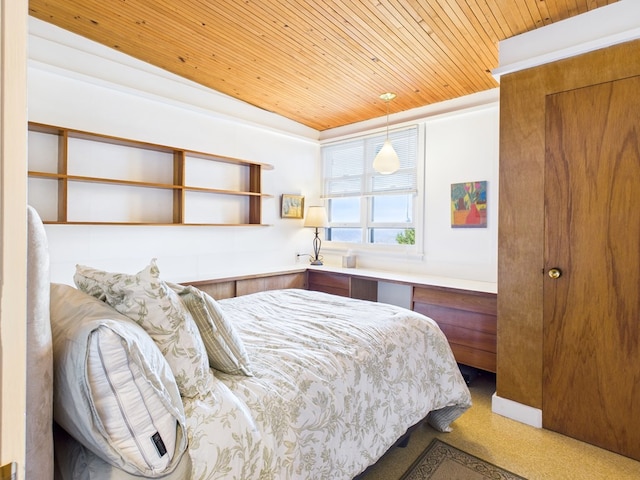 bedroom featuring light carpet and wood ceiling