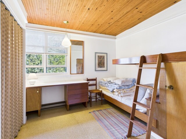 bedroom featuring light floors, wood ceiling, and baseboard heating