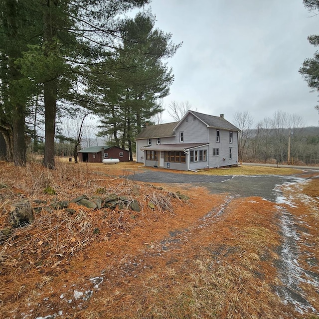 view of side of home featuring a porch