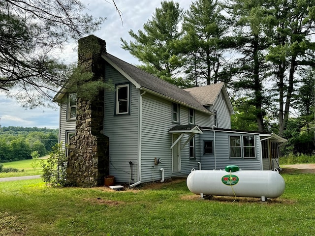 view of home's exterior with a lawn