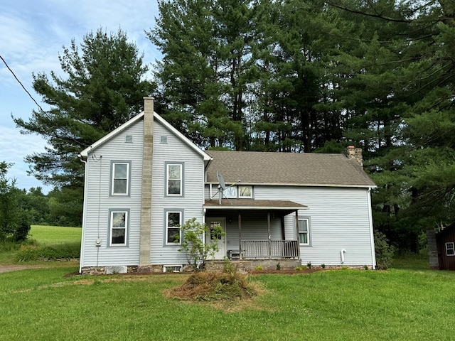 view of front facade featuring a front yard and a porch