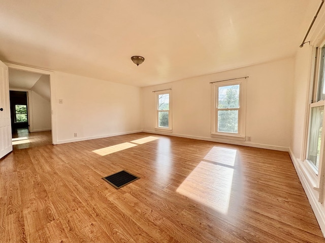 spare room featuring light hardwood / wood-style flooring