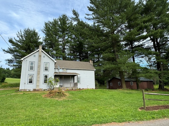 view of front of home featuring covered porch and a front yard