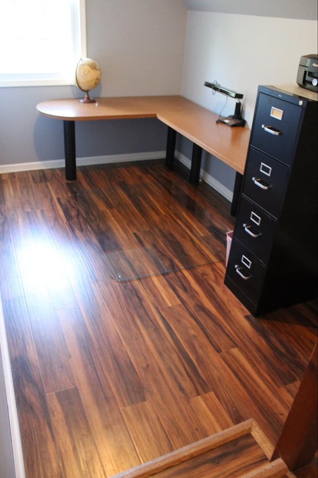 unfurnished office featuring dark wood-type flooring