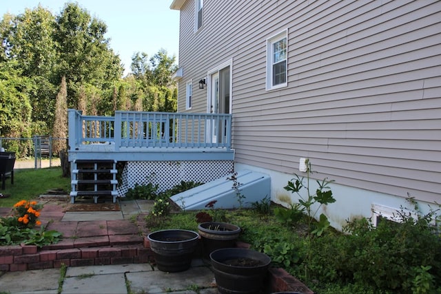 view of property exterior featuring a deck