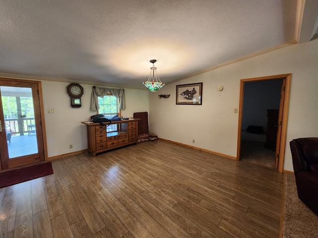 151 Ice Mine Rd, Coudersport, PA 16915 - unfurnished dining area with a textured ceiling, wood finished floors, ornamental molding, and lofted ceiling