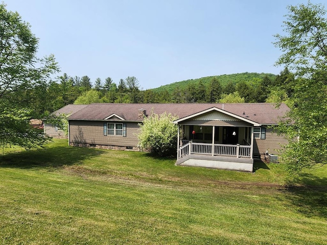 151 Ice Mine Rd, Coudersport, PA 16915 - back of house with a lawn, a sunroom, and a view of trees