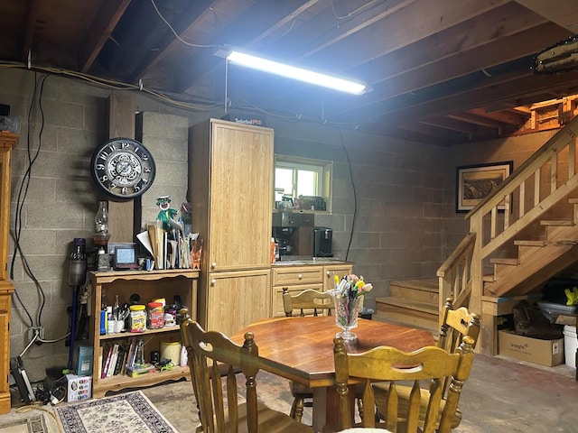 14 Here You Are Ln, Austin, PA 16720 - dining area with concrete floors, concrete block wall, and stairs