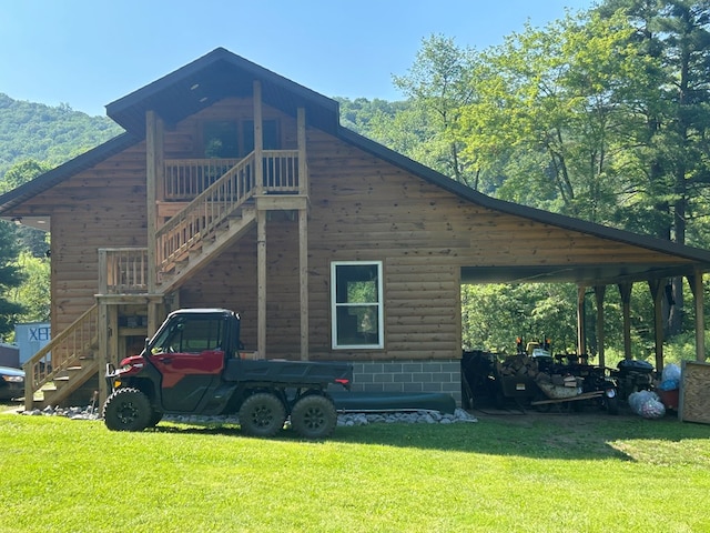 14 Here You Are Ln, Austin, PA 16720 - view of side of property with stairway, a lawn, and a carport