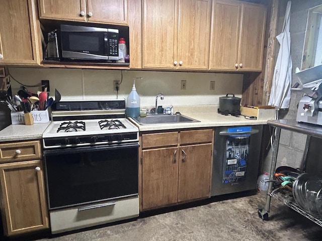 14 Here You Are Ln, Austin, PA 16720 - kitchen featuring range with gas stovetop, stainless steel microwave, and light countertops