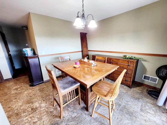 dining room with a notable chandelier