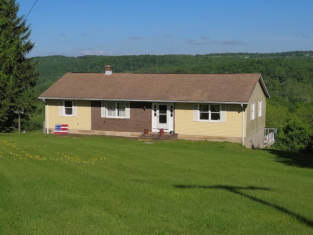 401 Valley View Rd, Wyalusing, PA 18853 - ranch-style home with a front lawn, a chimney, a forest view, and a shingled roof