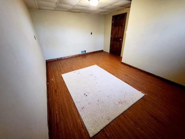 empty room featuring wood-type flooring