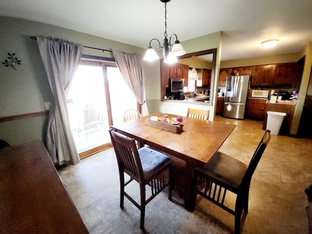 dining room featuring a chandelier