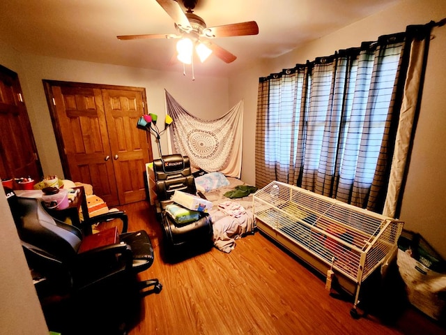 bedroom featuring ceiling fan and wood-type flooring