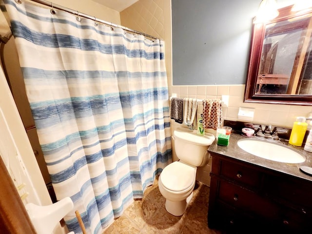 bathroom with vanity, a shower with curtain, toilet, tile walls, and tasteful backsplash