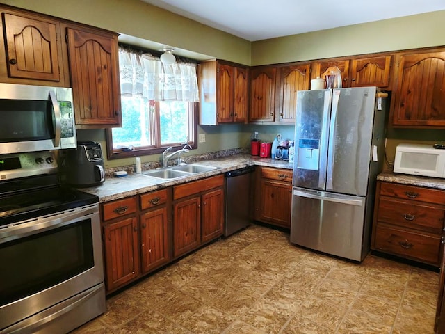 401 Valley View Rd, Wyalusing, PA 18853 - kitchen featuring appliances with stainless steel finishes and brown cabinetry
