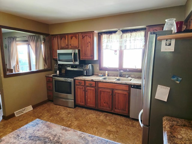 401 Valley View Rd, Wyalusing, PA 18853 - kitchen with appliances with stainless steel finishes and brown cabinets