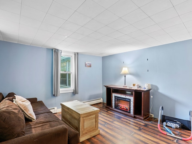 135 Middle Rd, Barton, NY 13734 - living area with baseboard heating, wood finished floors, and a lit fireplace