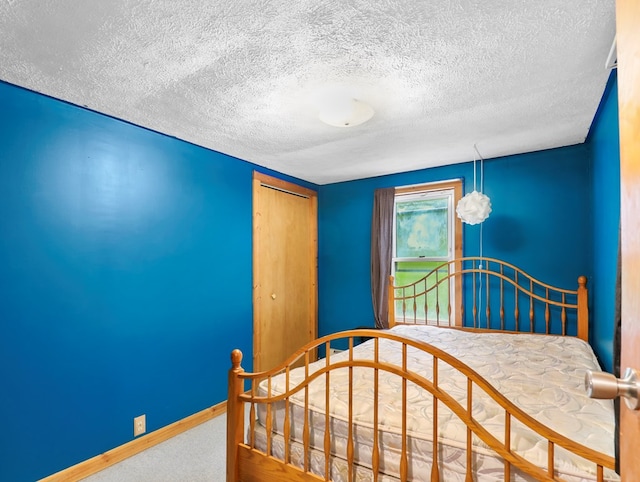135 Middle Rd, Barton, NY 13734 - bedroom with carpet, baseboards, a textured ceiling, and a closet