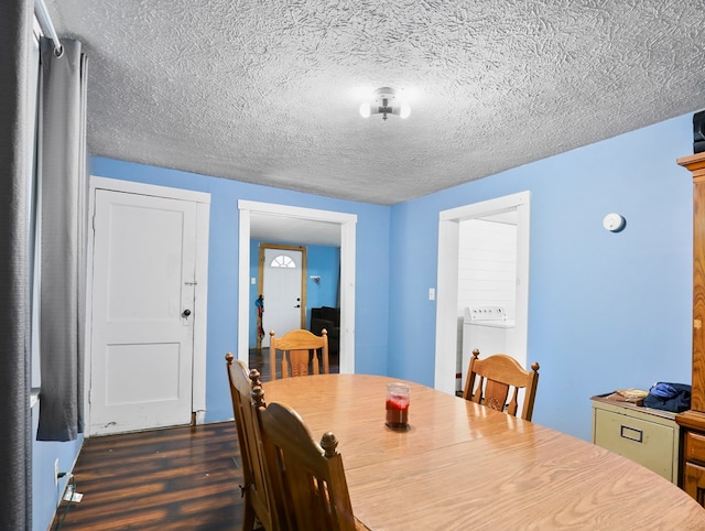 135 Middle Rd, Barton, NY 13734 - dining area with dark wood-style flooring, washer / clothes dryer, and a textured ceiling