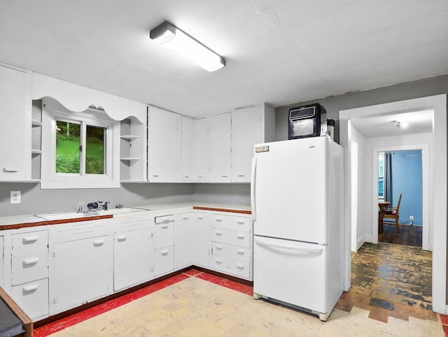135 Middle Rd, Barton, NY 13734 - kitchen featuring freestanding refrigerator, open shelves, white cabinets, and light countertops