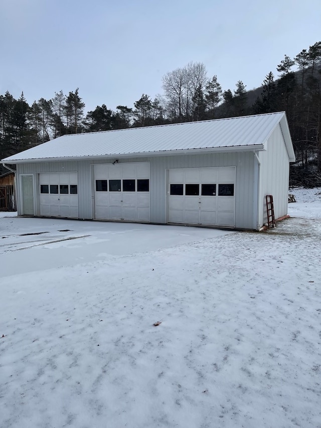 view of snow covered garage