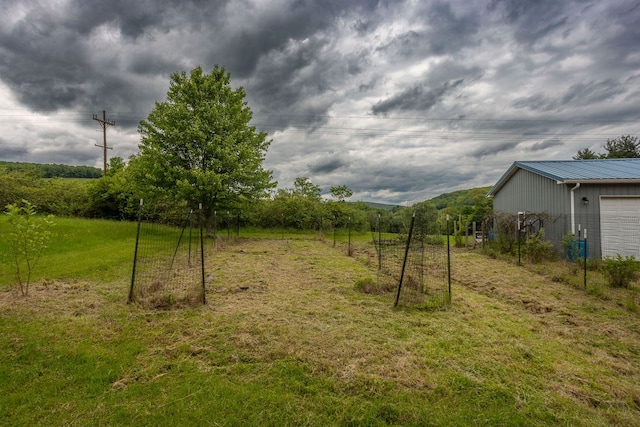 315 Old Tioga St, Wellsboro, PA 16901 - view of green lawn with a garage
