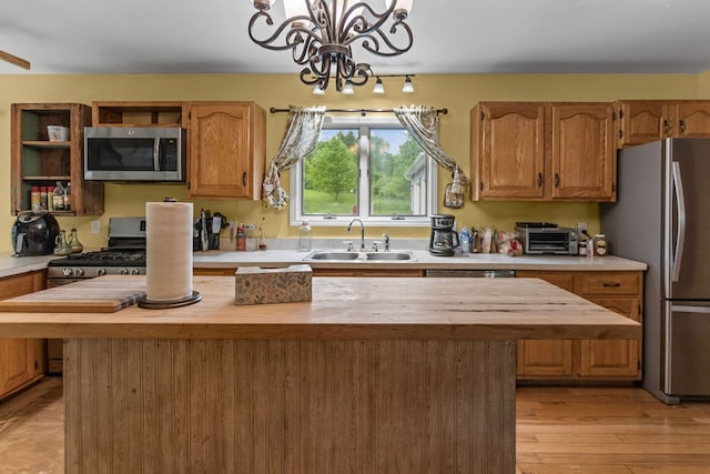 315 Old Tioga St, Wellsboro, PA 16901 - kitchen with stainless steel appliances, a sink, wooden counters, a center island, and a chandelier