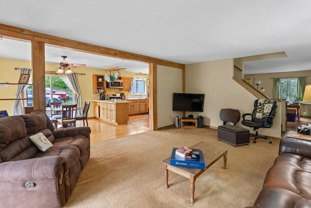315 Old Tioga St, Wellsboro, PA 16901 - living room with light colored carpet, a ceiling fan, and baseboards