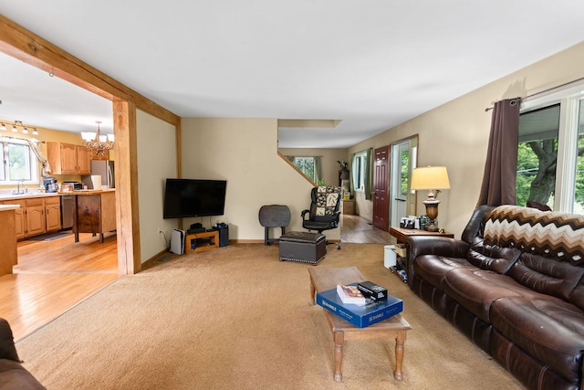 315 Old Tioga St, Wellsboro, PA 16901 - living room featuring a chandelier, plenty of natural light, and light wood-style floors